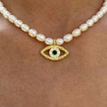 Pearl beaded hammered eye necklace