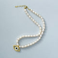 Pearl beaded hammered eye necklace