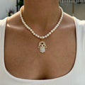 Pearl beaded baguette hamsa necklace