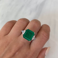 Sterling silver Emerald green ring with triangle cut side stones