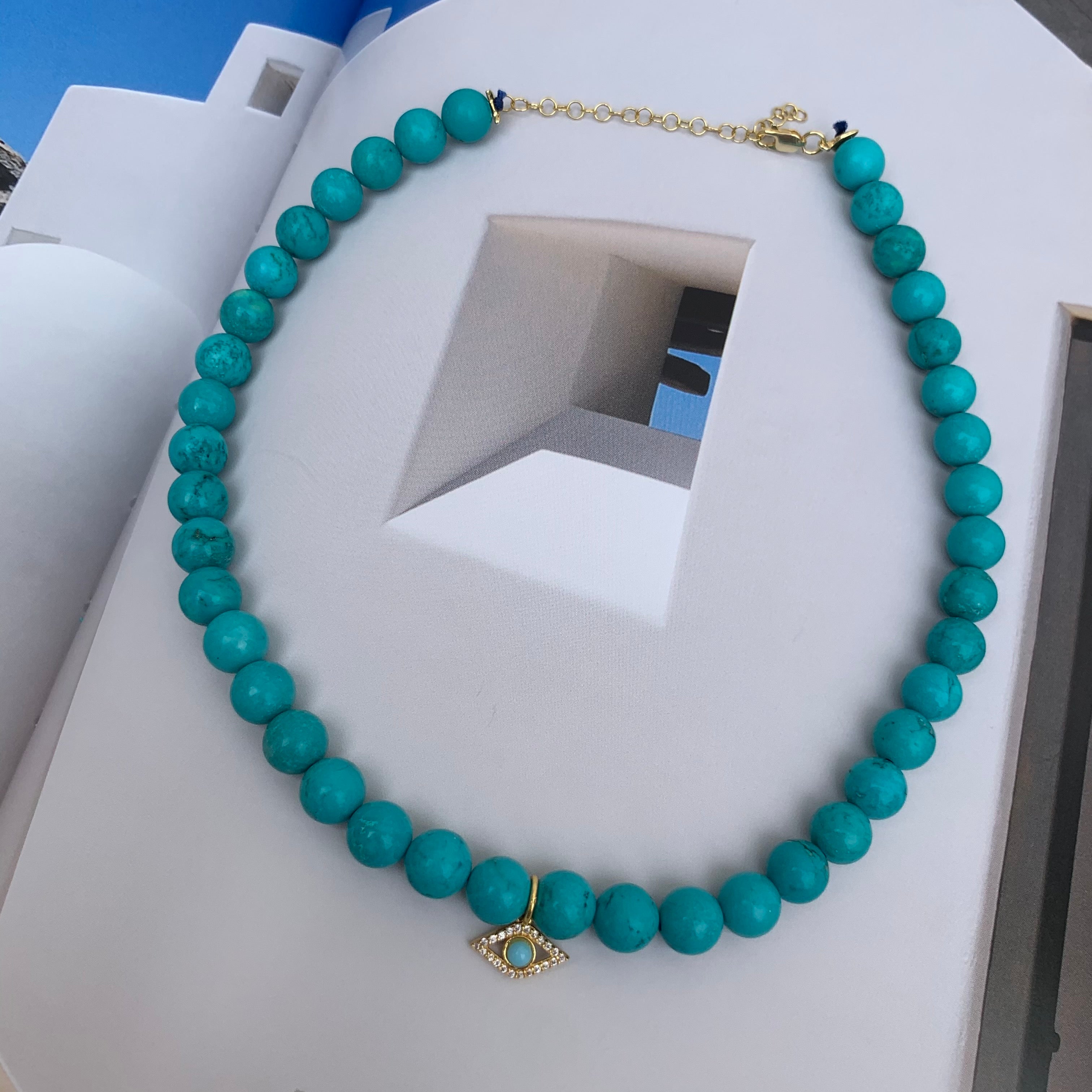 Turquoise beaded gold eye necklace