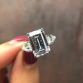Sterling silver emerald cut cz ring with heart side stones