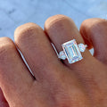 Sterling silver emerald cut cz ring with heart side stones