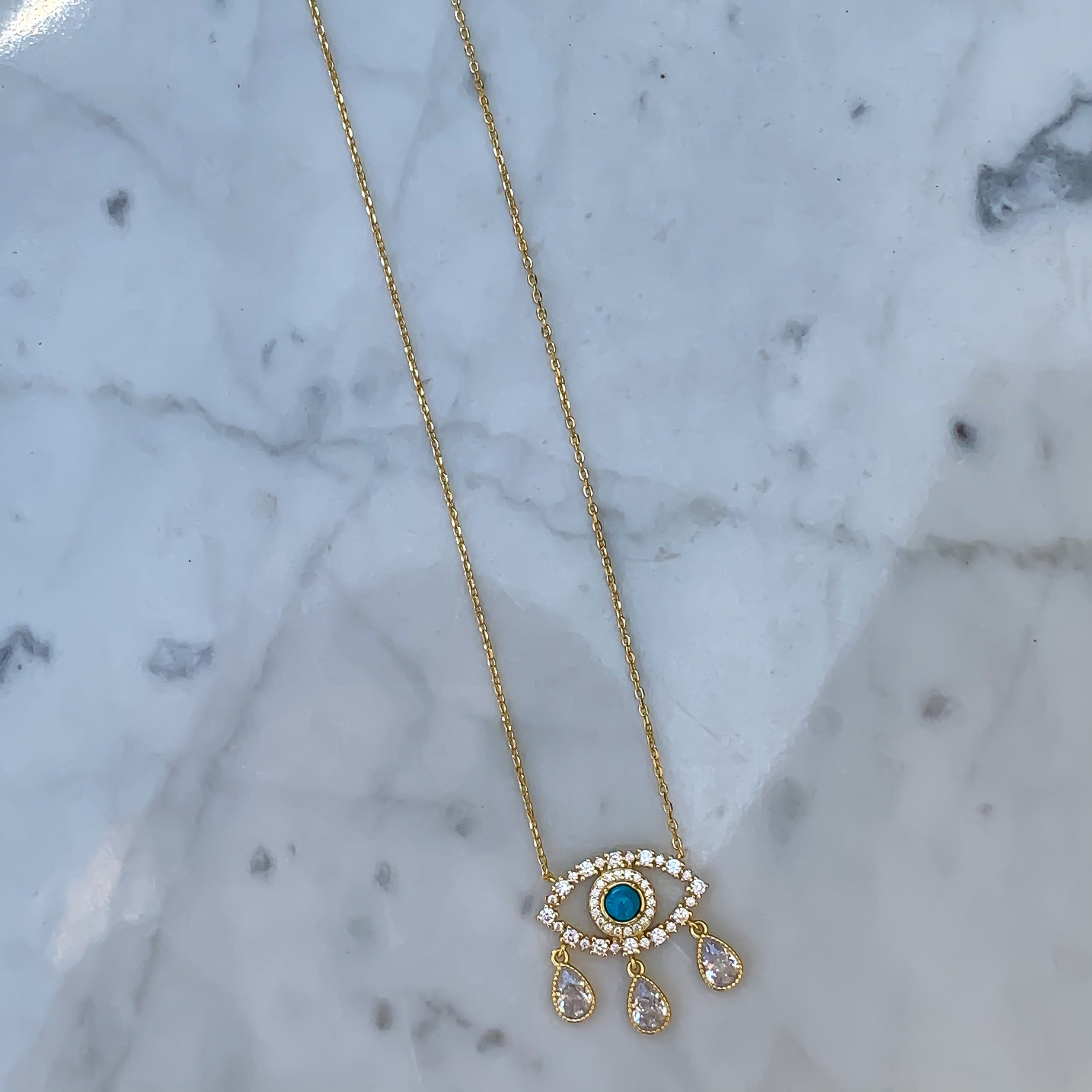 Gold plated turquoise “Diamond Tears" eye necklace
