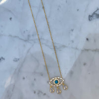 Gold plated turquoise “Diamond Tears" eye necklace